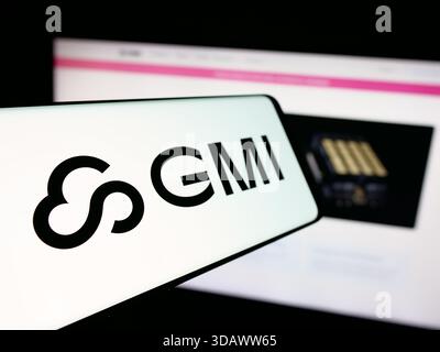 Stuttgart, Germany - 11-30-2025: Smartphone with logo of cloud services company GMI Computing US Inc. on screen in front of website. Stock Photo