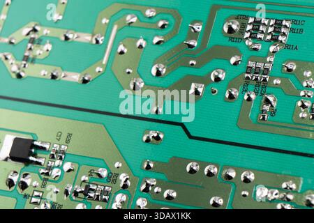 Circuit board with resistors microchips and electronic components background. Computer hardware technology. Stock Photo