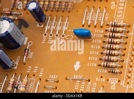 Circuit board with resistors microchips and electronic components background. Computer hardware technology. Stock Photo