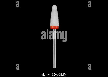 Ceramic cutter for grinding and polishing in manicure and pedicure. Drill with abrasive grain isolated on black background. Stock Photo