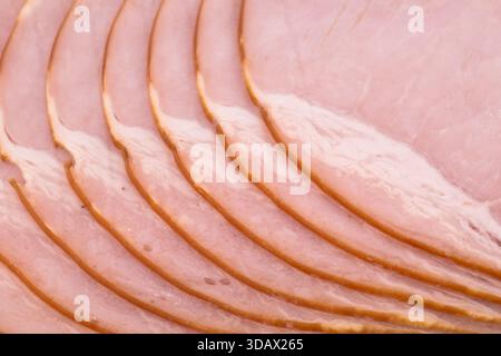 Siced smoked ham meat texture background. Raw ham pattern Stock Photo