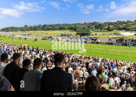 Spectators At The Races Spectators at the race course watching a horse race finish Stock Photo ...