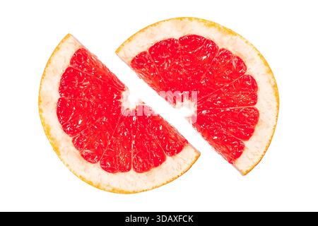 A slice of grapefruit is cut in half, revealing its juicy red interior. Concept of freshness and vitality, as the bright red color of the grapefruit c Stock Photo