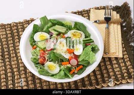 Tossed salad with hard boiled eggs Stock Photo