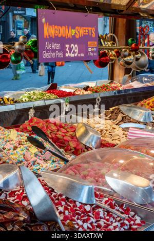 colourful selection of sweets and confectionery on a market stall in Southampton city centre, UK Stock Photo