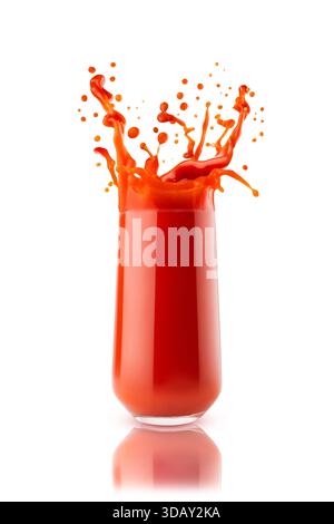 Bright red fresh tomato juice in glass with dynamic splashes, flying drops, isolated on white background. Vitamin vegetable smoothie for healthy fitne Stock Photo