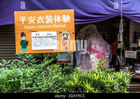 A sign for Heian Kimono Rental lists prices starting at 3,000 yen for a two-hour rental on the Kumano Kodo pilgrimage route, Nachikatsuura, Wakayama Prefecture, Japan. Tourists can dress in Heian-period kimonos to walk the Daimon-zaka section up to Nachi Taisha Shrine. Stock Photo