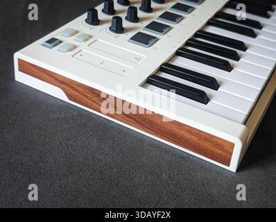 minimalist white midi keyboard controller for digital music production Stock Photo