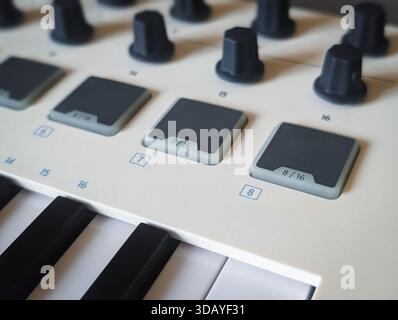 minimalist white midi keyboard controller for digital music production Stock Photo