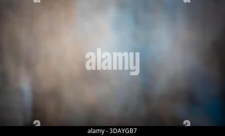 Soft abstract blurred background with smooth gradient transitions in beige, gray, and blue tones. Defocused texture with subtle light and shadow Stock Photo