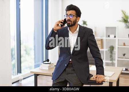 Businessman on Phone in Office Stock Photo