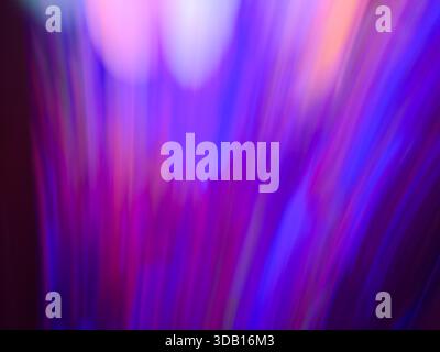Vibrant colorful neon light streaks in blue pink and violet purple tones creating dynamic motion and gradient glow Stock Photo