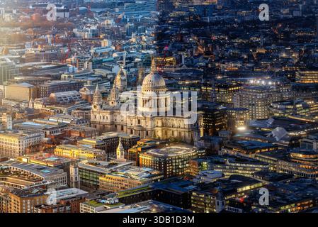 Conceptual day and night view of the illuminated St. Pauls Cathedral and skyline in London, England Stock Photo
