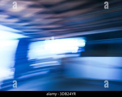 Defocused blurry movie film projects interior backdrop. Blurred motion minimalistic  background of making TV commercial movie. Stock Photo