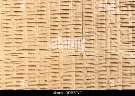 Shredded cardboard creates an abstract corrugated texture for sustainable packaging. Full frame Stock Photo
