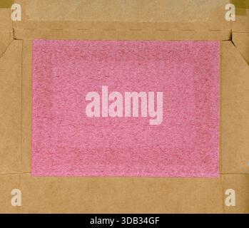 pink plastic and brown cardboard texture useful as a background Stock Photo