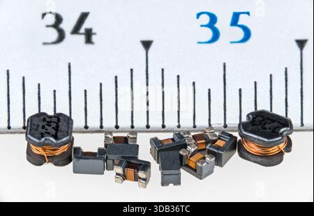 Component Ruler Scale An electronic measuring device with a ruler component alongside a rock ...