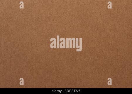 Craft Paper Surface with Grainy Texture and Earth Color Macro View Stock Photo