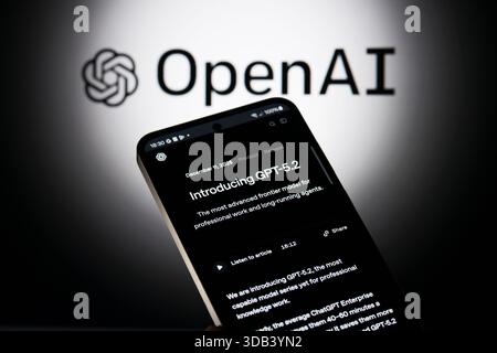 Brussels, Belgium. 13th Dec, 2025. The OpenAI introducing GPT 5.2 is being displayed on a mobile phone with the company branding visible seen in the background, in this photo illustration. Taken in Brussels, Belgium, on 13 December 2025. (Jonathan Raa/Sipa USA) *** Strictly for editorial news purposes only *** Credit: Sipa USA/Ģ����ý Live News Stock Photo