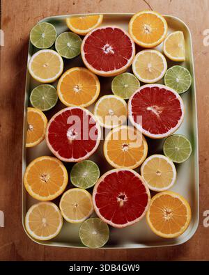 Halved lemons, oranges, limes and grapefruits Stock Photo