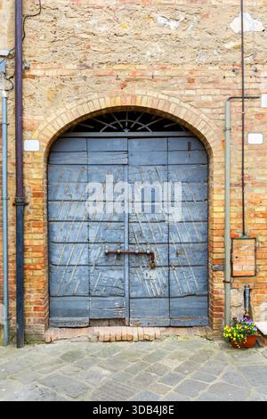 Old weathered blue garage door in a house Stock Photo