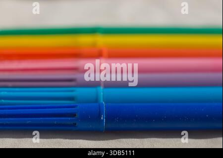 horizontal view of colored felt tip pens with soft focused white background Stock Photo