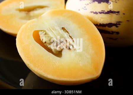 A closeup view of a halved pepino melon. Stock Photo