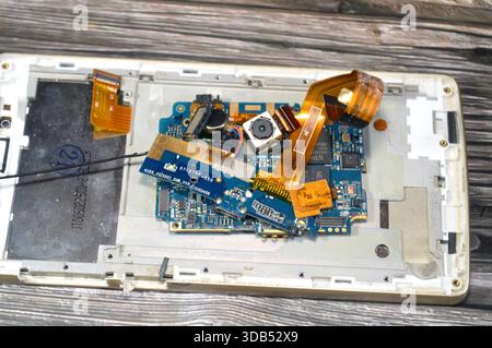 Cairo, Egypt, December 9 2025: Cell phone repair involves core internal parts like the motherboard PCB, CPU, RAM, storage, and various Integrated Circ Stock Photo
