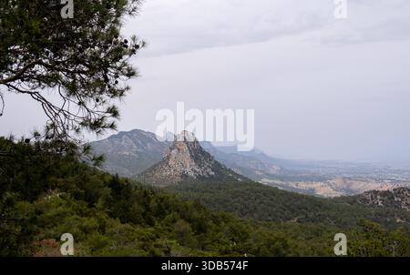 A stunning view of a rugged mountain range under a cloudy sky.Pentadaktylow mountain top cyprus Stock Photo