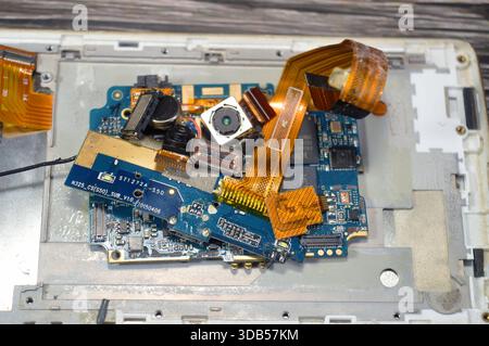 Cairo, Egypt, December 9 2025: Cell phone repair involves core internal parts like the motherboard PCB, CPU, RAM, storage, and various Integrated Circ Stock Photo