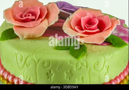 Elegant Green Fondant Cake with Pink and Purple Sugar Rose Flowers for Wedding Birthday Celebration Stock Photo