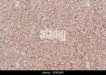 High-resolution, seamless background texture of a rough aggregate terrazzo or washed concrete surface. Features a pattern of small pebbles and rock fr Stock Photo