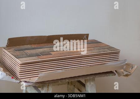 the kitchen tile in the cardboard package is open Stock Photo