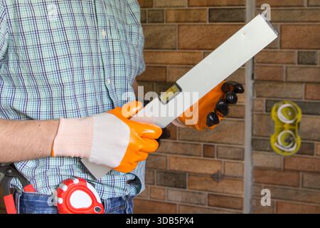 man builder with tools in hands Stock Photo
