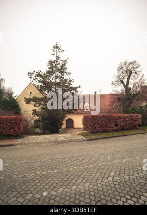 French Manor style natural stone home with paving stone driveway Stock ...