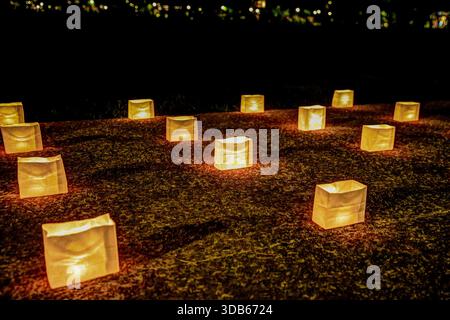 Elegant outdoor dining setup with candles and floral arrangement at a luxury resort in Halkidiki, Greece. Stock Photo
