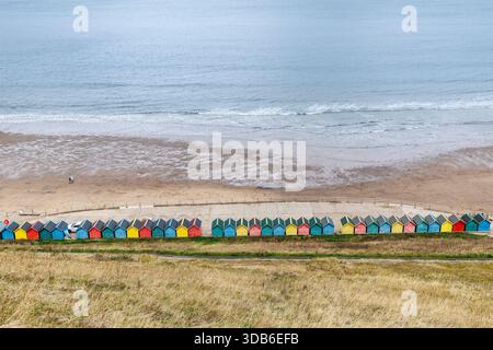 Brightly painted beach huts, Whitby, Yorkshire, England, UK Stock Photo