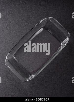A rectangular transparent glass tray for baking and cooking at home. The glass tray as a food backdrop for your design Stock Photo