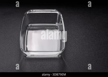 A rectangular transparent glass tray for baking and cooking at home. The glass tray as a food backdrop for your design Stock Photo