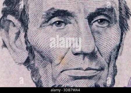 Abraham lincoln's detailed face portrait on a us five dollar bill Stock Photo