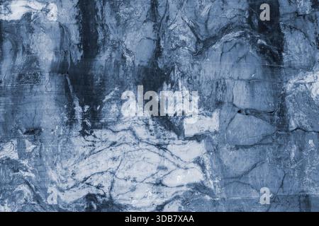 High resolution close-up of natural blue toned marble stone surface with veins and cracks, suitable as abstract background. Stock Photo