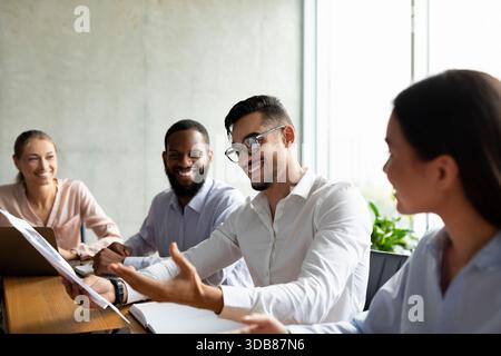 Group of Diverse Coworkers Collaborating on a New Project During a Corporate Meeting in an Office Stock Photo