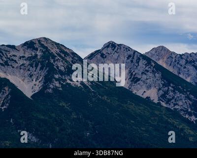 Aerial view of the rocky Monte Baldo ridge above forested slopes near Malcesine on the eastern shore of Lake Garda. Stock Photo