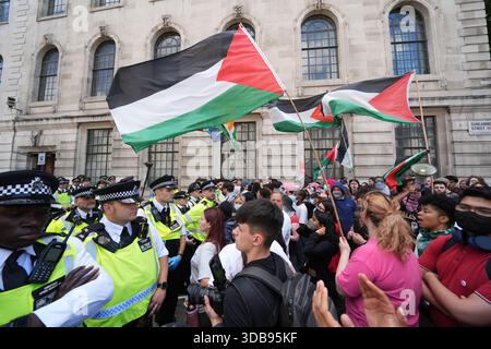PA REVIEW OF THE YEAR 2025. File photo dated 23/06/25: Police block the way of people taking part in a demonstration in central in London in support of Palestine Action as the Home Secretary was preparing to ban Palestine Action, making it a criminal offence to belong to or support them, following the group's vandalism of two planes at an RAF base. Issue date: Monday December 15, 2025. Stock Photo