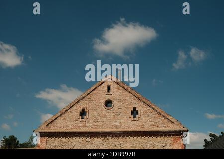 Charming weathered brickwork details a rustic building, suggesting history and enduring craftsmanship. Stock Photo