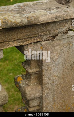 Close up view of aged stone, showing beautiful texture and subtle moss growth, ideal for backgrounds. Stock Photo