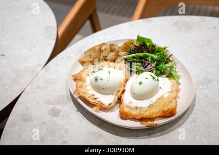 Eggs Benedict dish for breakfast. High angle view. Stock Photo
