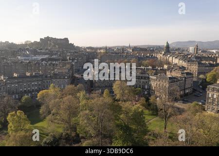 Aerial view of Edinburgh Castle looms over the city's historic architecture, a tapestry of stone and greenery under a soft sky, Moray Feu, Scotland, U Stock Photo