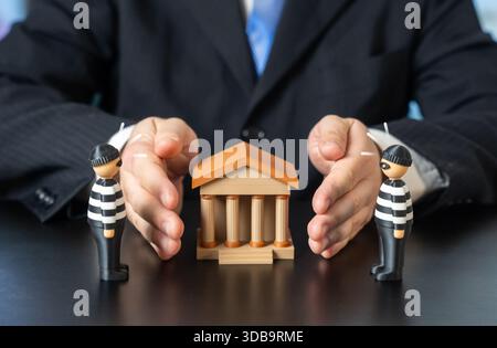 Protecting your bank from attackers and fraudsters. Safeguarding client data, digital assets and transactions against hacking, scams and internal thre Stock Photo