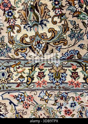 Close-up of a detailed, traditional floral carpet pattern. Stock Photo